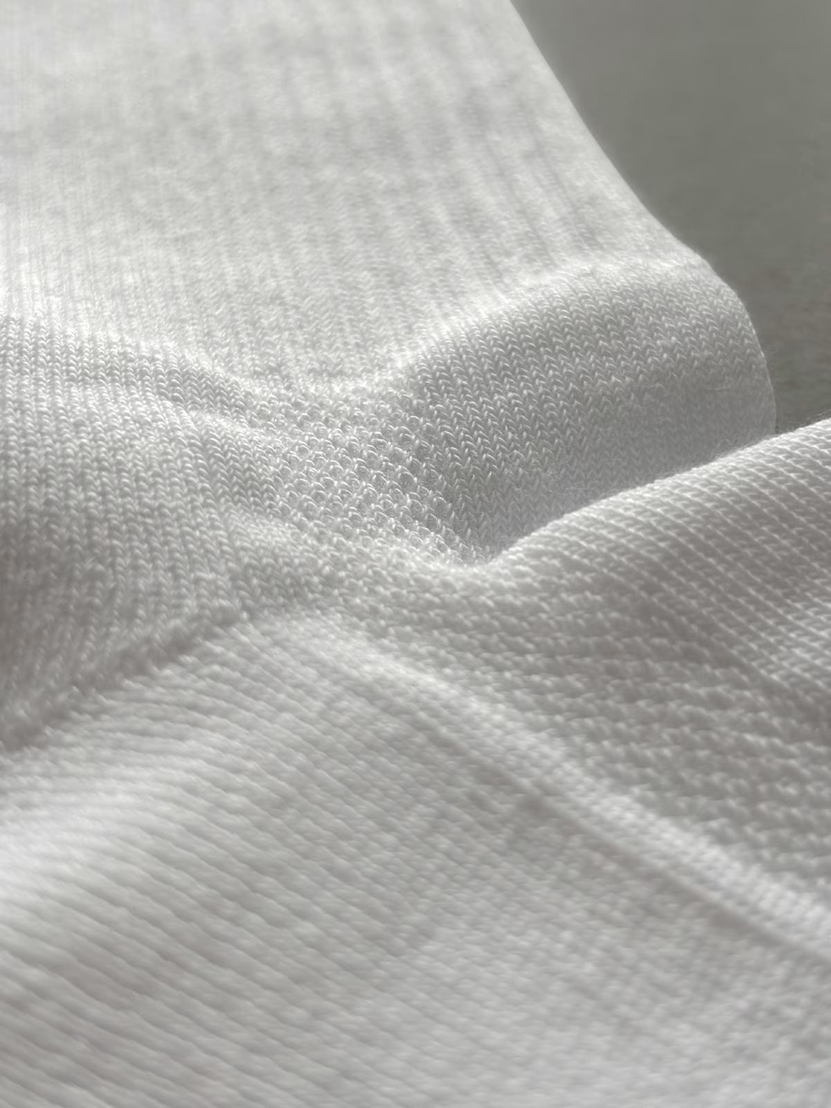 Close-up of textured mesh panels and white fabric